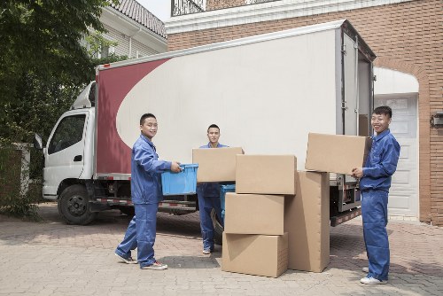 Organised moving boxes labelled for rooms in a Belsizepark home