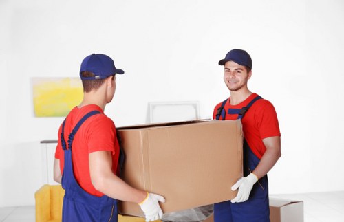 Professional packing setup with boxes and protective wraps in Belsizepark