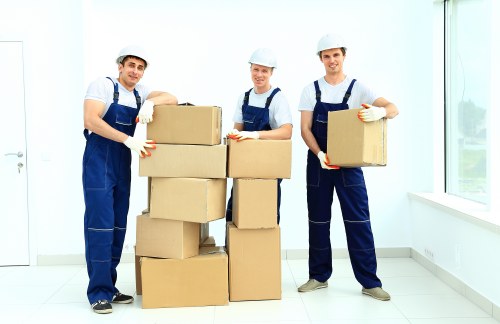 Professional house removalists in Belsizepark loading furniture into a moving van