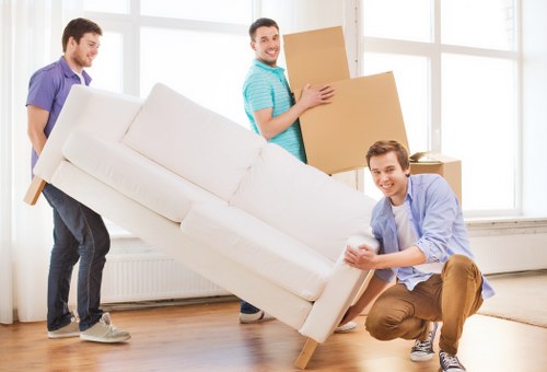 Packing and loading furniture into a moving truck in Belsize Park
