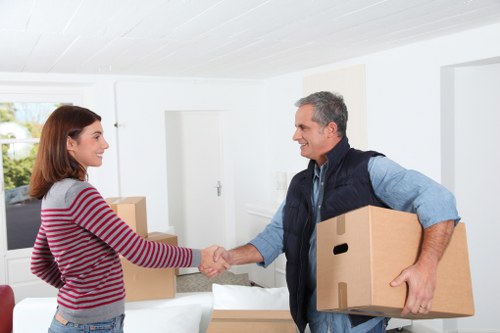 Packed office boxes and labelled items for commercial relocation
