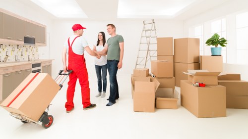 Team loading office furniture during a Belsizepark pick-up