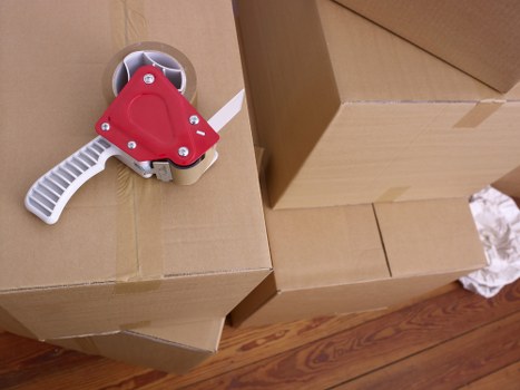 Local movers transporting boxes and household items in Belsize Park